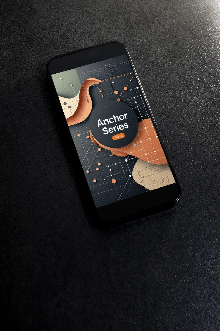 A black smartphone lying diagonally on a dark textured surface, displaying a digital design template or app interface titled 'Anchor Series' with abstract shapes in orange, beige, and black.
