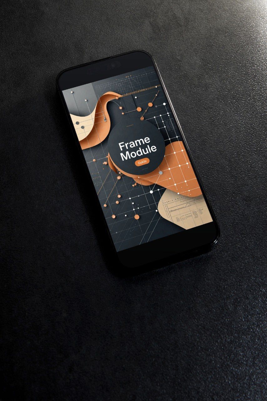 A black smartphone lying diagonally on a dark textured surface, displaying a digital interface graphic with the text 'Frame Module' on the screen.